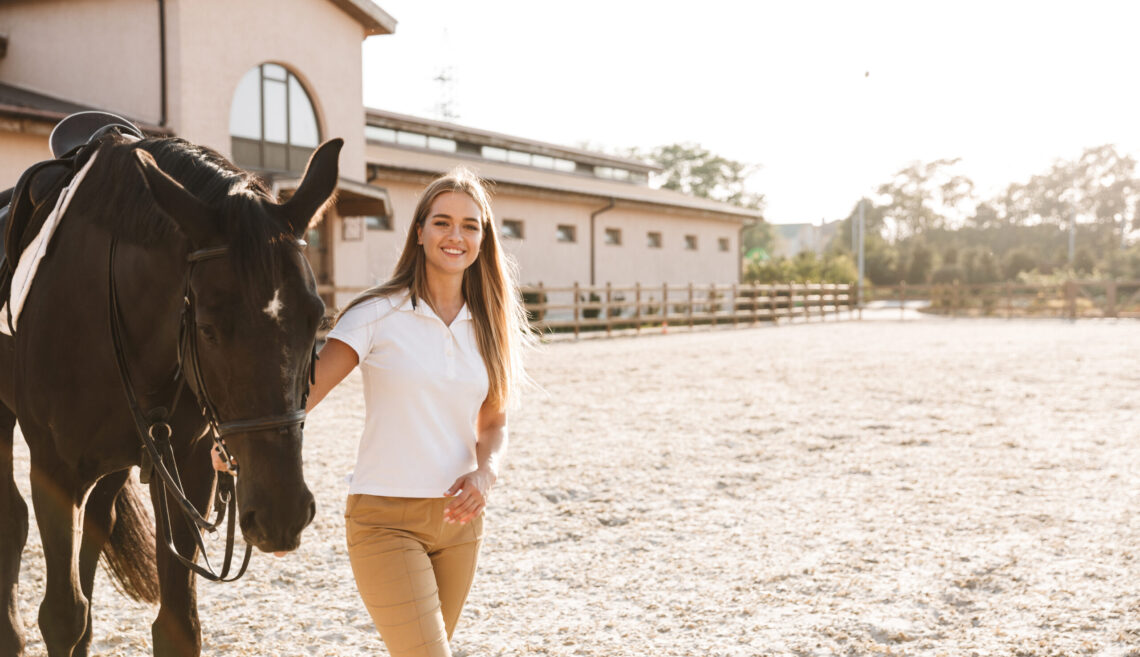 Beautiful woman with horse in countryside